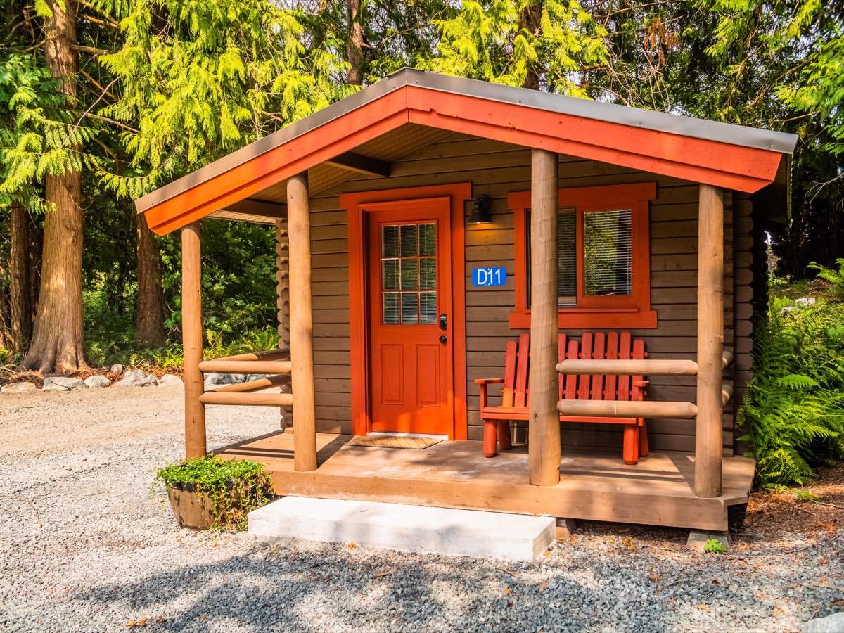 Red camping cabin with covered porch