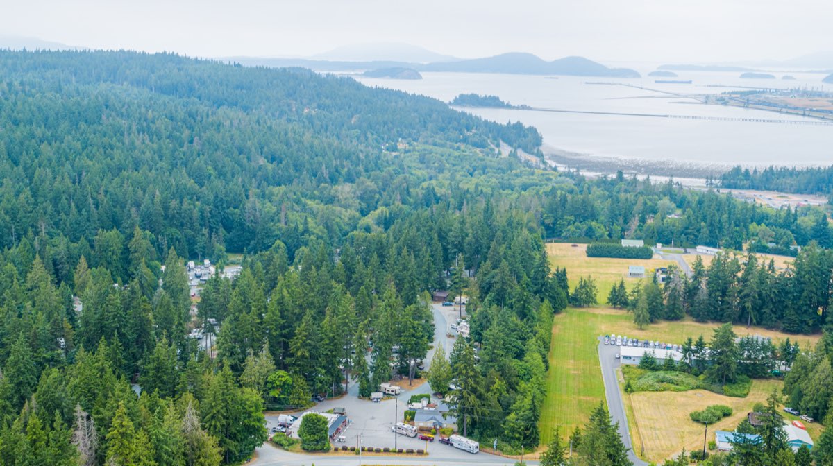 Aerial of the park set among forest and water views